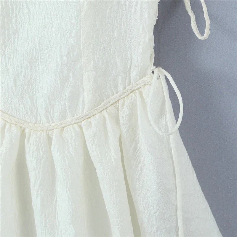 Hulianfu White Strap Dress 2026  Spring Summer New Sexy Holiday Fashion Slim Waist Hollow Tie Short Mini Dress For Women - Deanwangkt