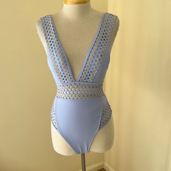 New! River Island SZ 4, light lavender blue with gold cut out plunge swimsuit.