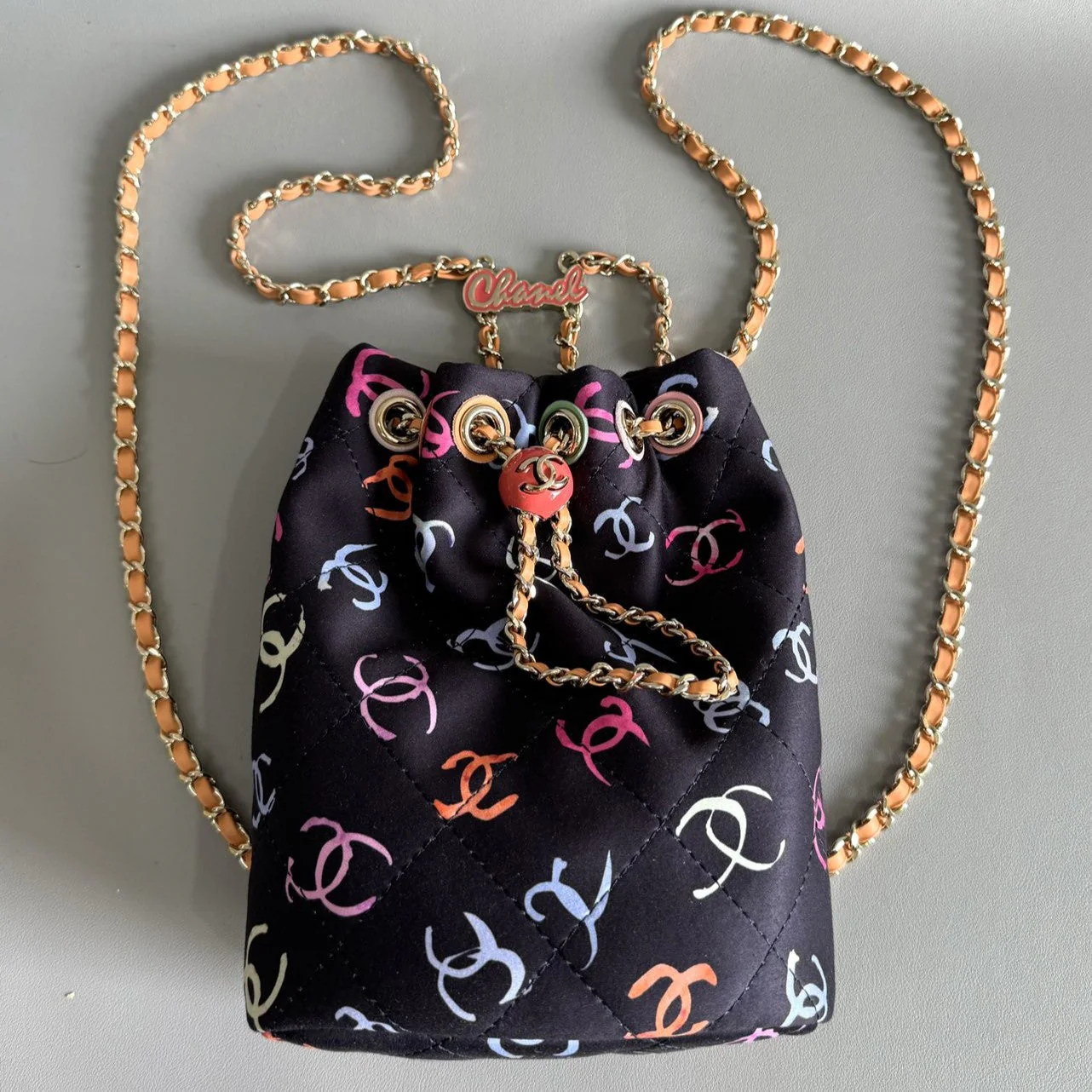 CHANEL BACKPACK 22CM BLACK & MANY OTHER COLORS PRINTED FABRIC GOLD HARDWARE