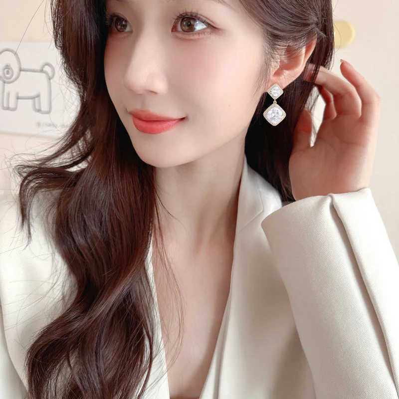 2025 Bright super flash geometric rhombus square earrings women's commuting zircon inlaid niche temperament high-end earrings wholesale - Deanwangkt