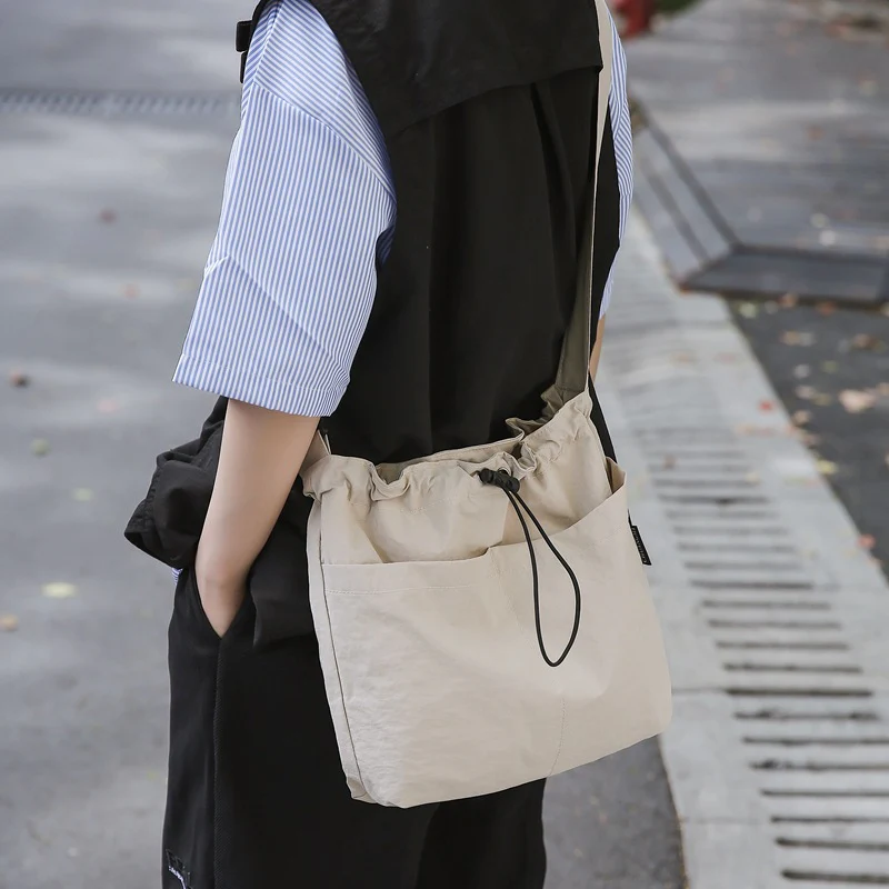 DEANWANGKT 2025 Korean version of fashion nylon shoulder bag popular new casual drawstring canvas messenger bag large capacity men's and women's tote bag - Deanwangkt