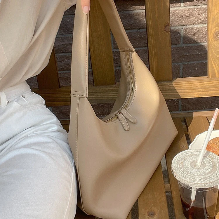 DEANWANGKT 2025 Milk tea color bag gentle wind Korean ins simple and versatile portable soft leather dumpling bag retro shoulder armpit bag - Deanwangkt